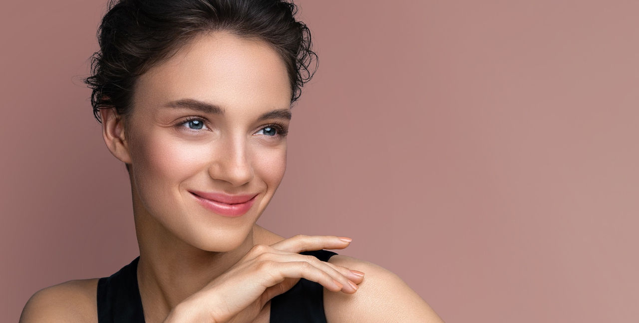 a woman looking over shoulder and smiling